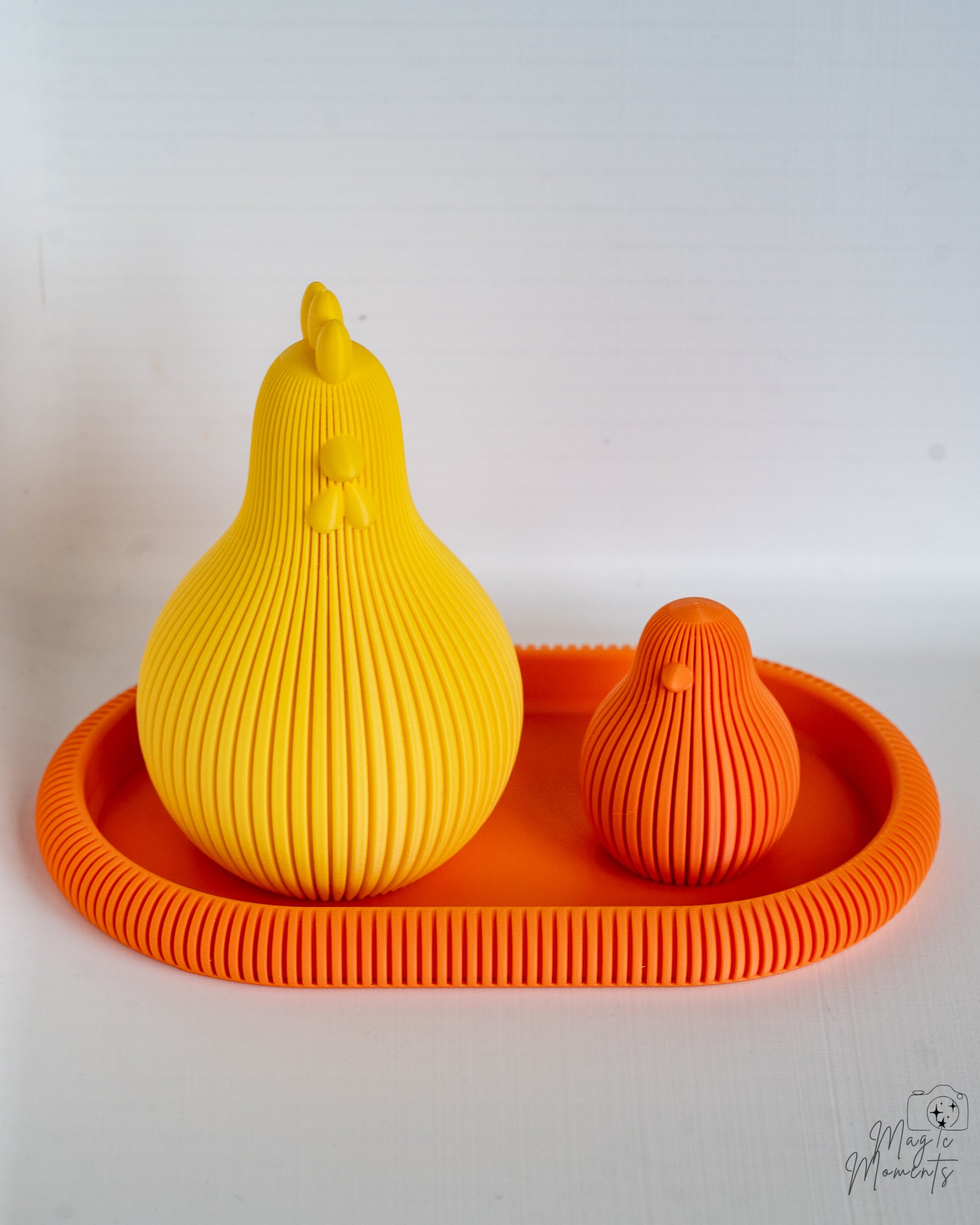 Yellow and orange chicken figures on orange tray