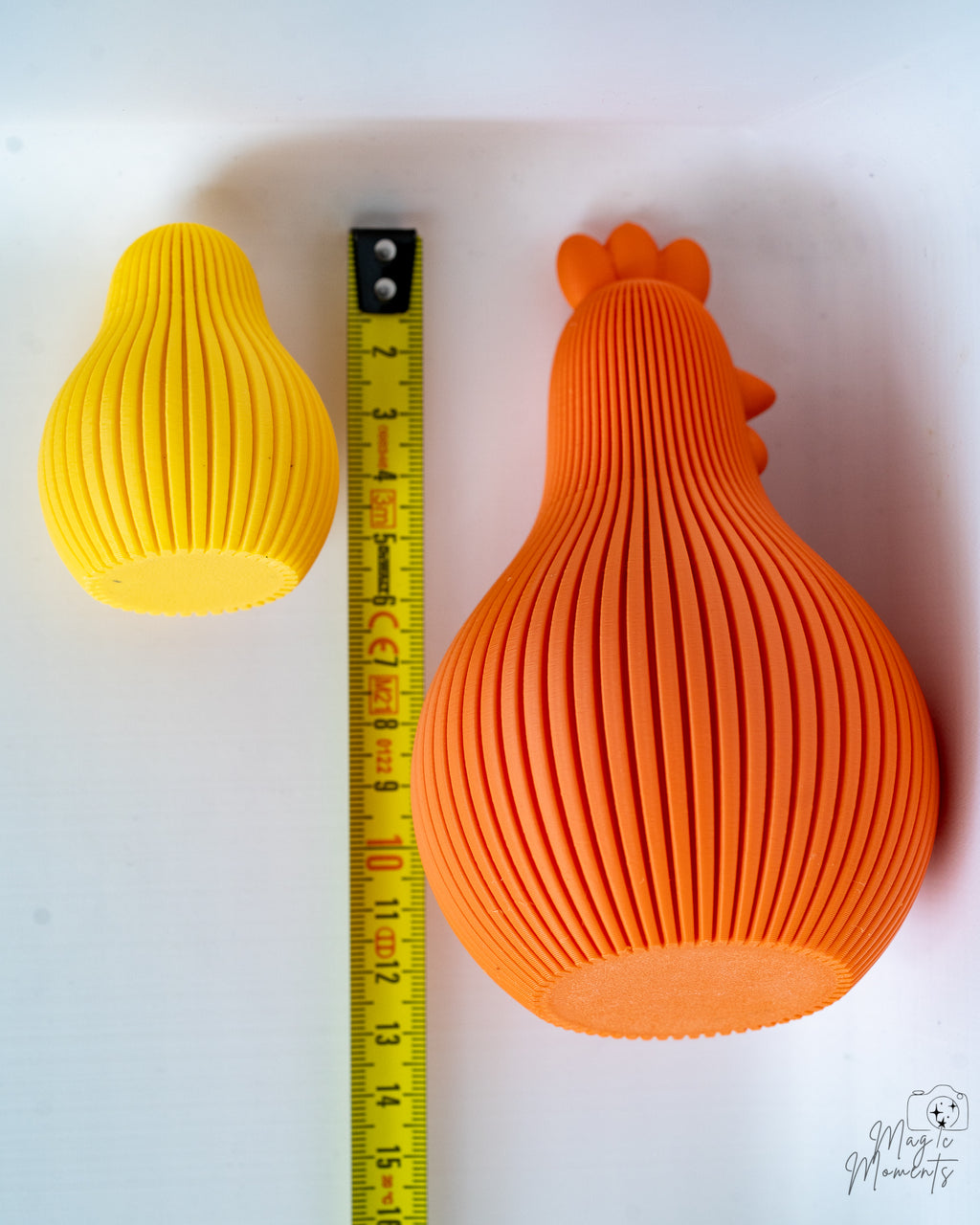 Orange chicken figure next to measuring tape for scale