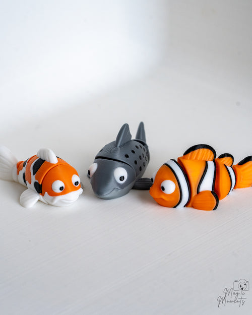 Cute clownfish salmon and koi fish figures displayed together