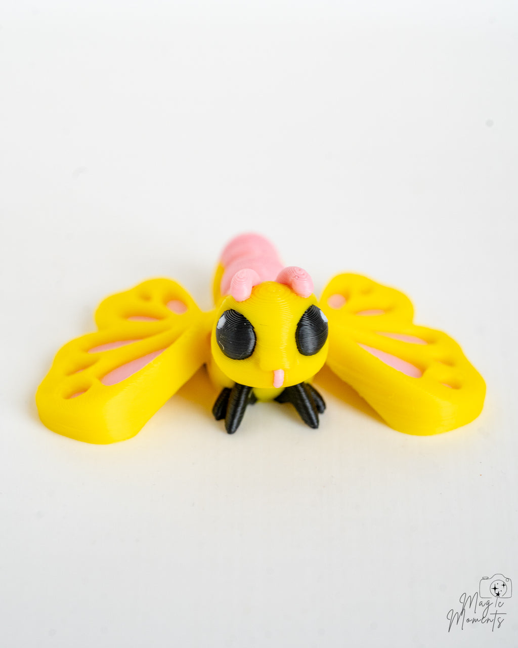 Cute yellow butterfly with pink wing details