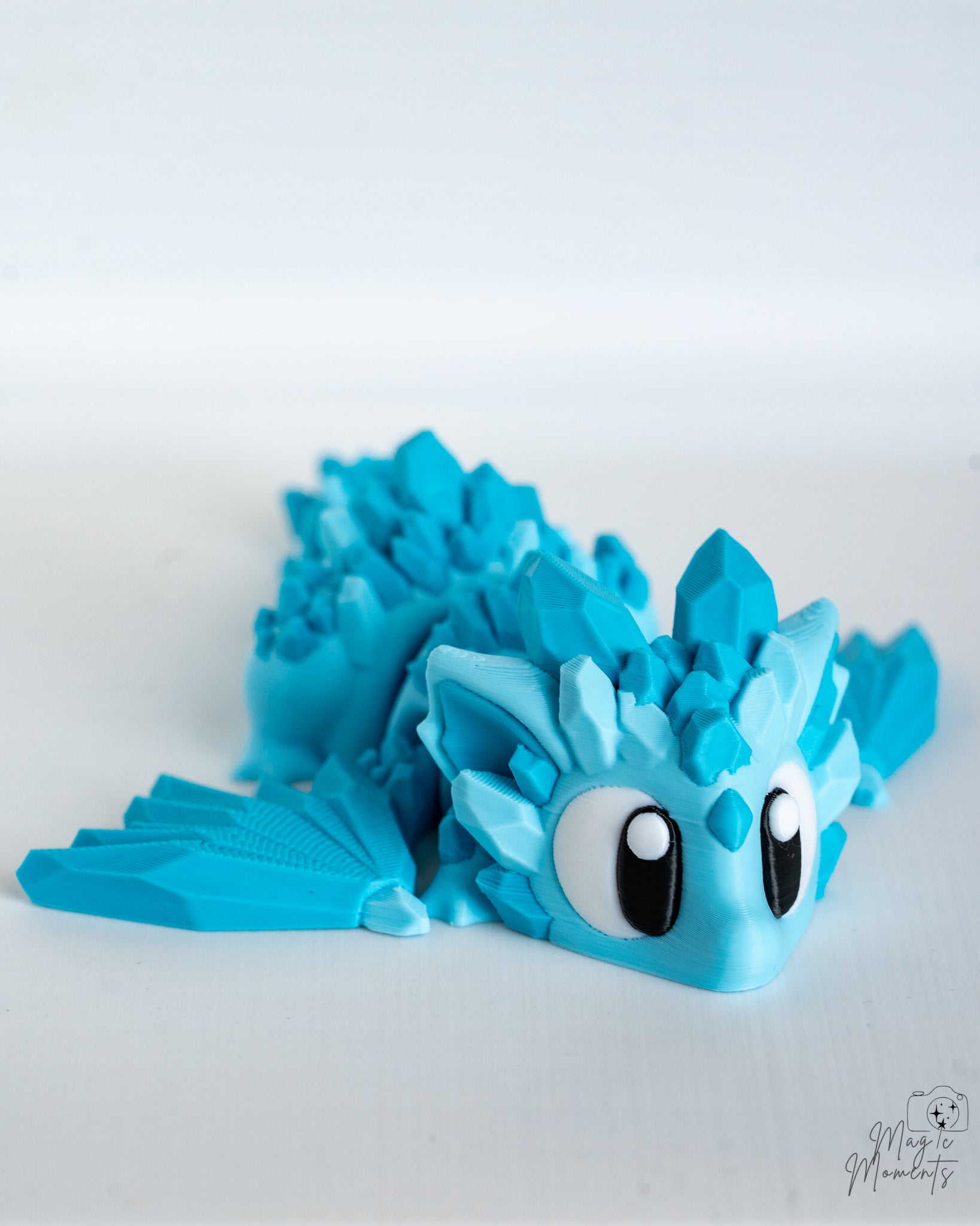 Mini crystal dragon with cartoon style eyes