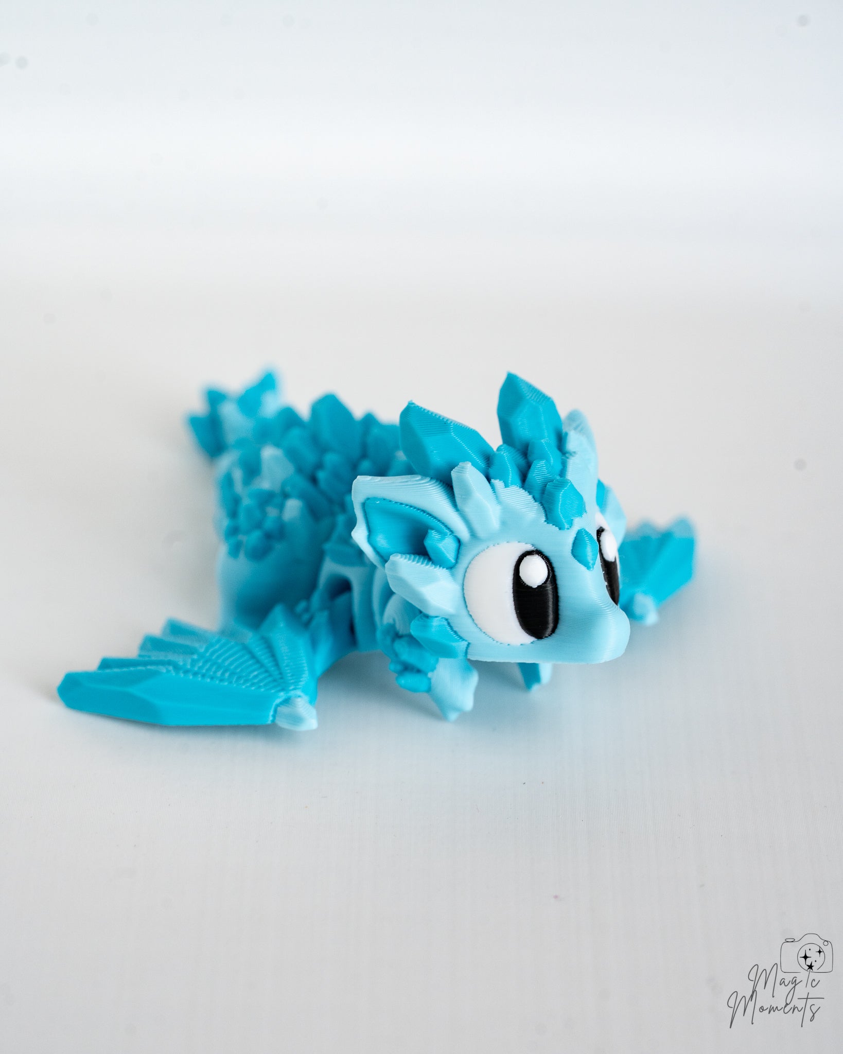 Mini crystal dragon with cartoon style eyes