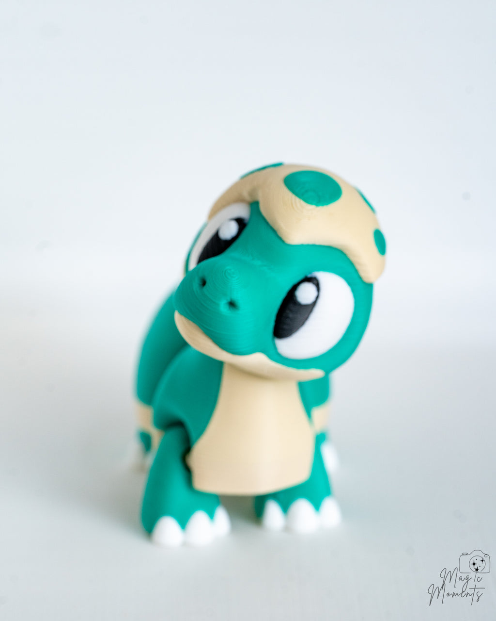 Mini dinosaur decorations with large cartoon eyes