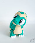 Mini dinosaur decorations with large cartoon eyes