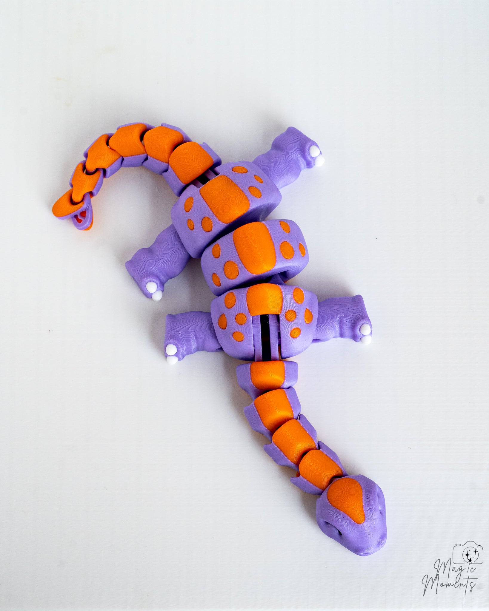 Flexible dinosaur figure with segmented movable body