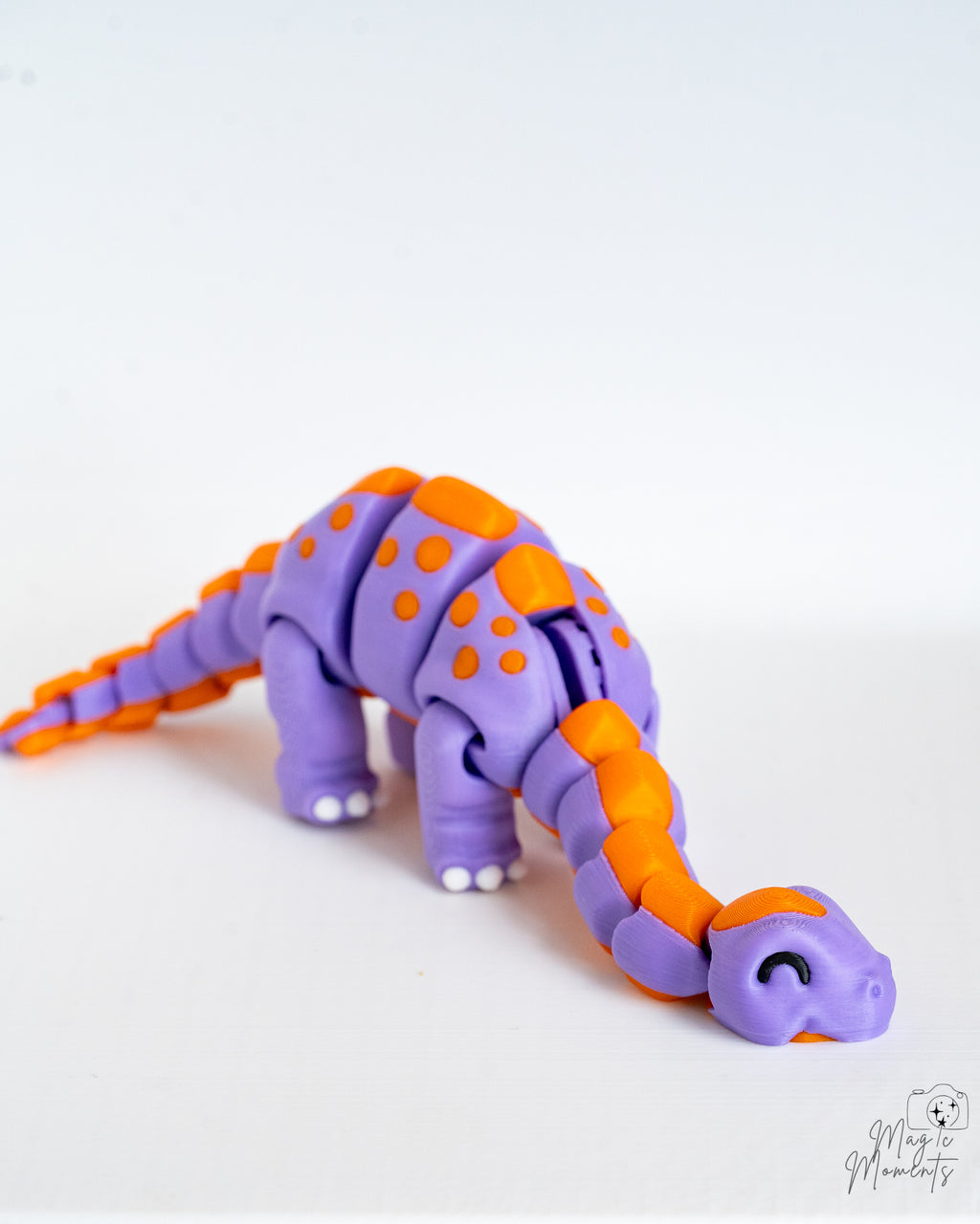 Flexible dinosaur figure with segmented movable body