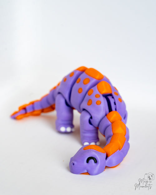Cute articulated dinosaur in purple and orange colours
