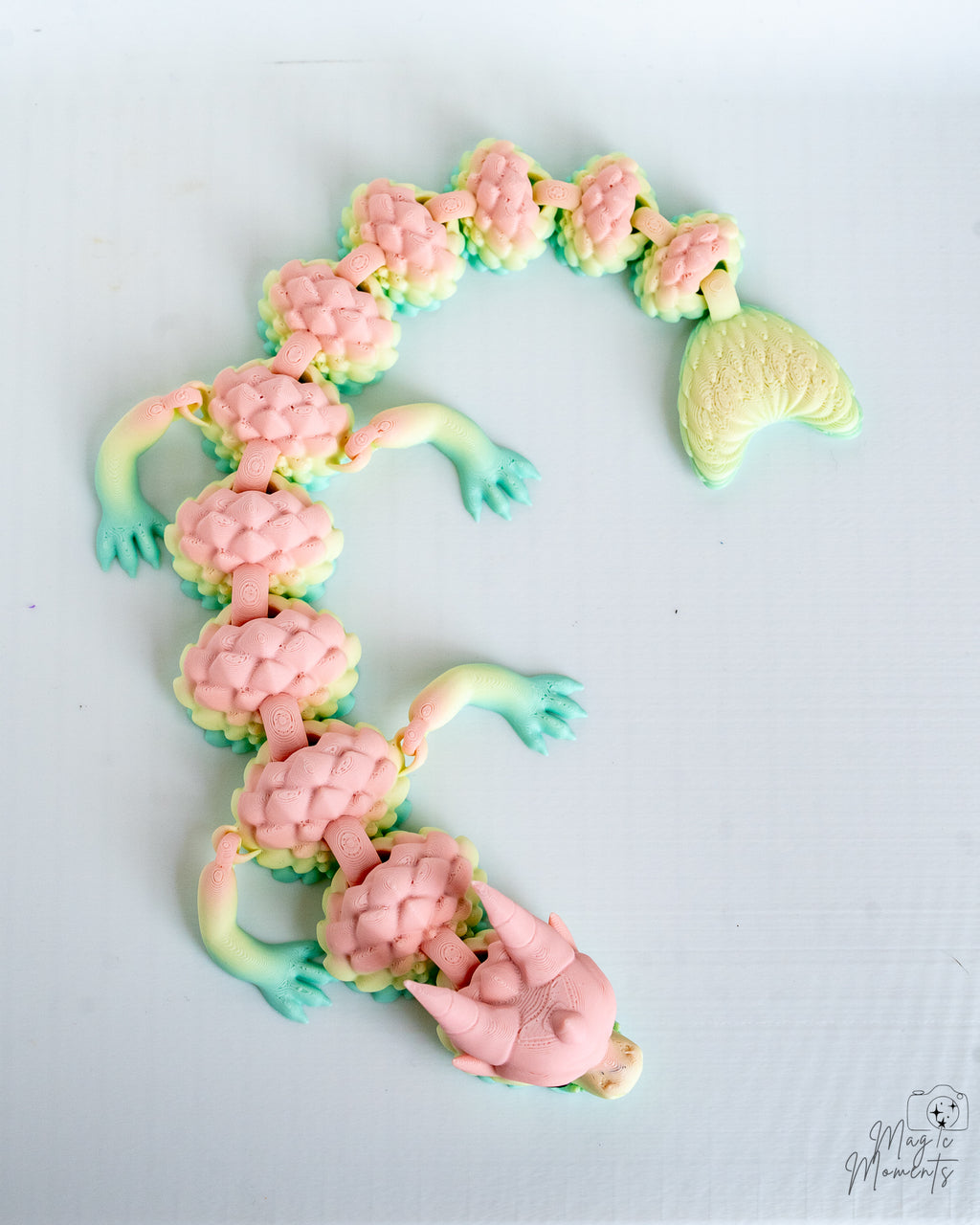 Articulated pastel dragon with textured scales