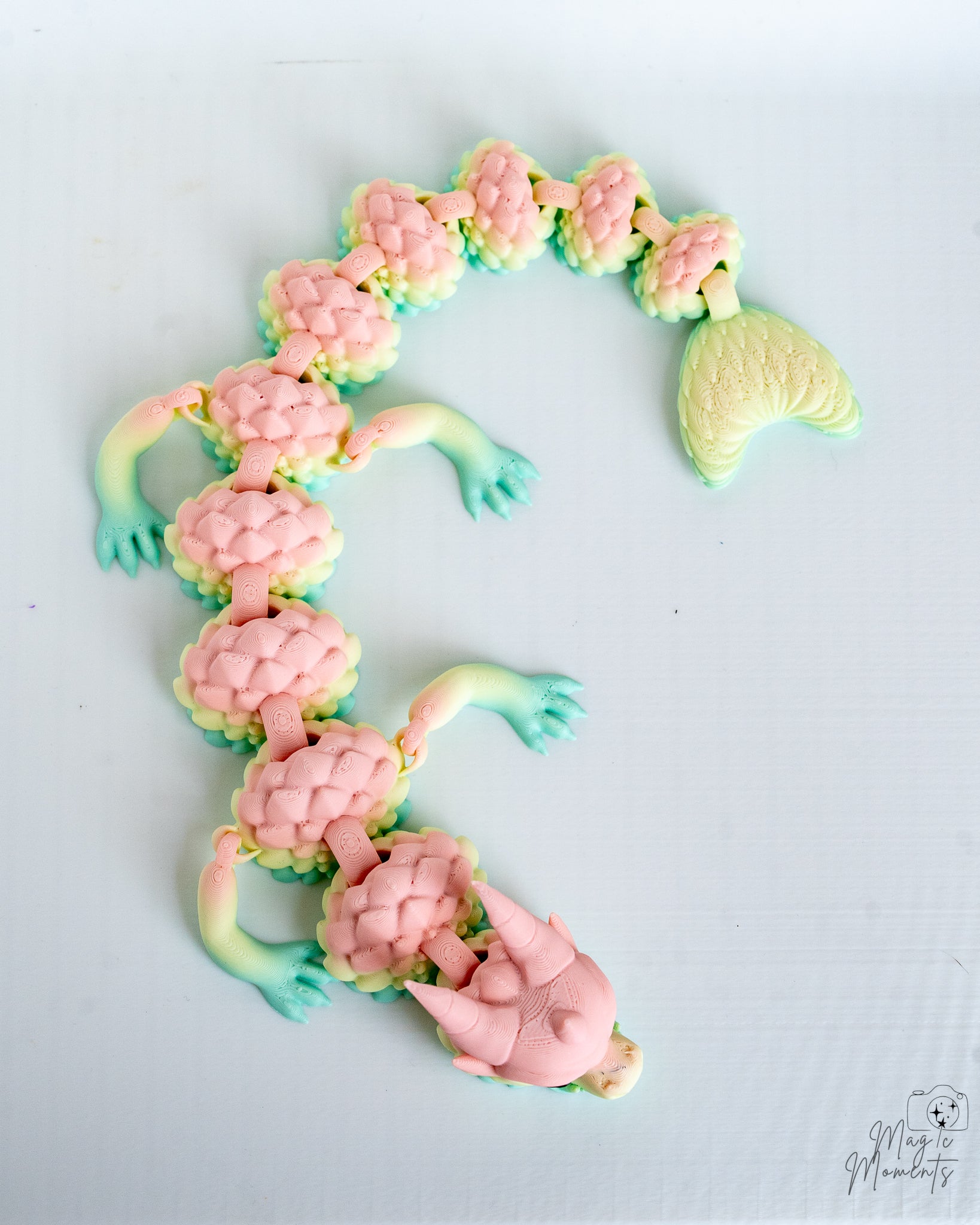 Articulated pastel dragon with textured scales