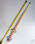 Articulated dragon next to measuring tape for scale