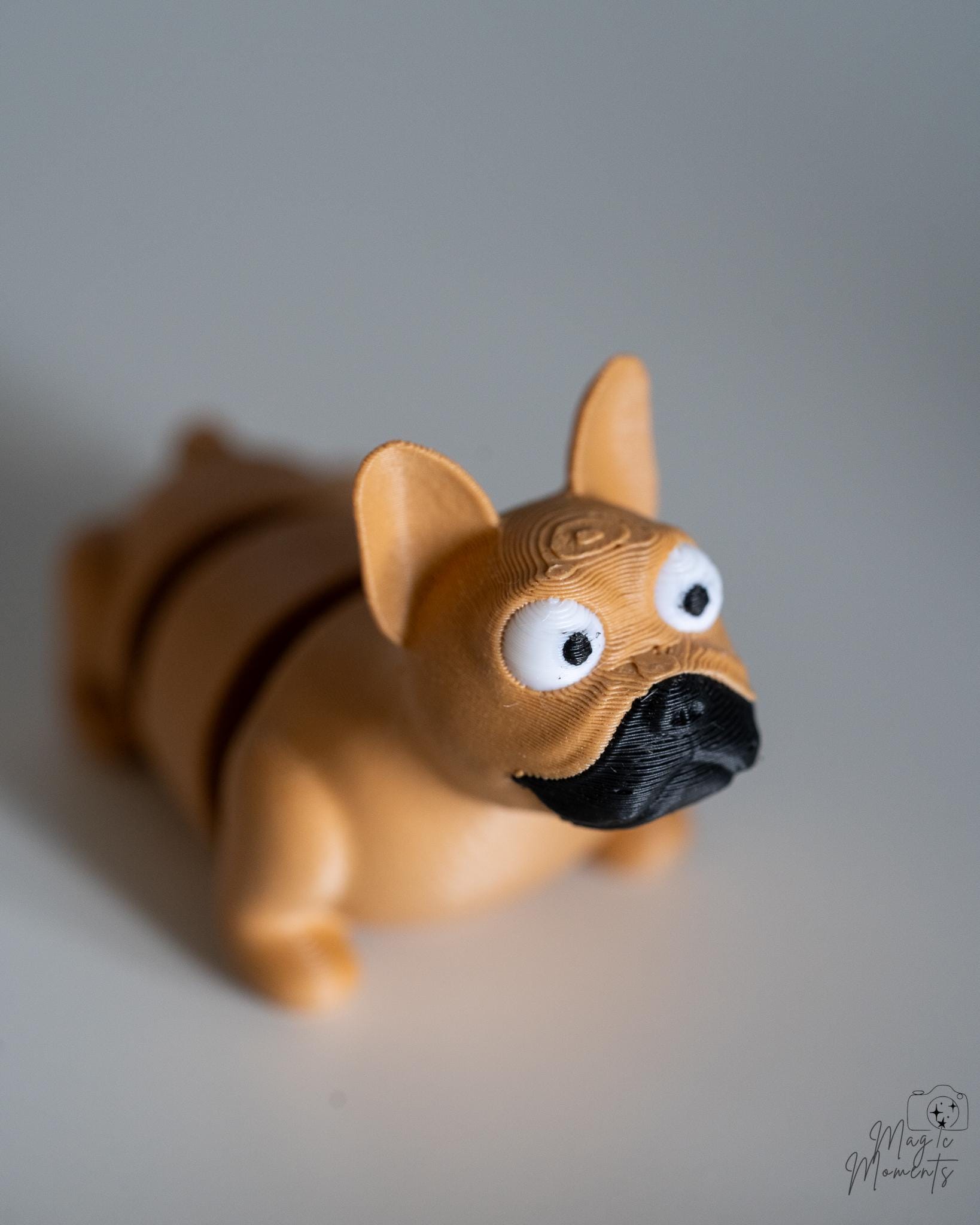french bulldog articulated dog figure with cartoon eyes