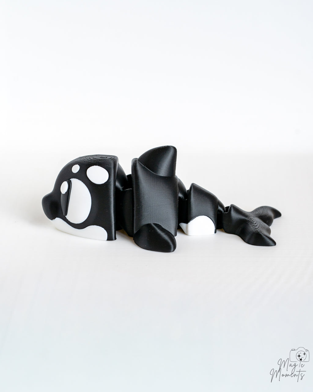 Orca whale figure viewed from side