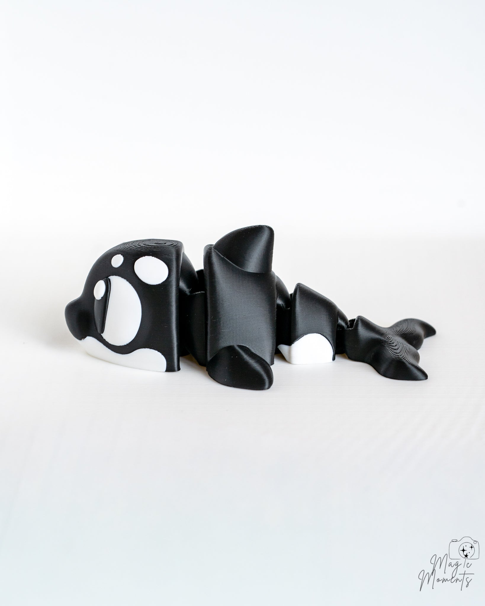 Orca whale figure viewed from side