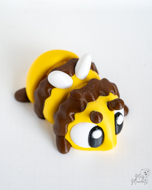 Mini bee figurine with cartoon eyes