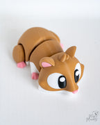 Mini hamster figurine with large cartoon eyes