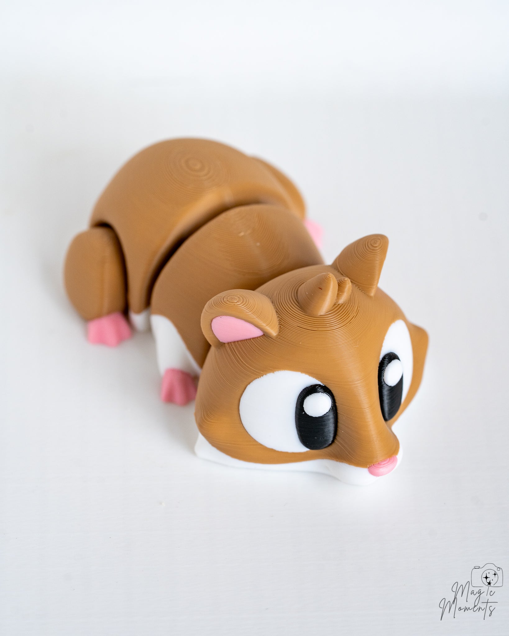 Mini hamster figurine with large cartoon eyes