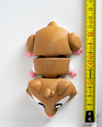 Hamster figure next to measuring tape for scale