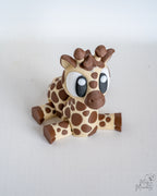 Cute giraffe figurine sitting down