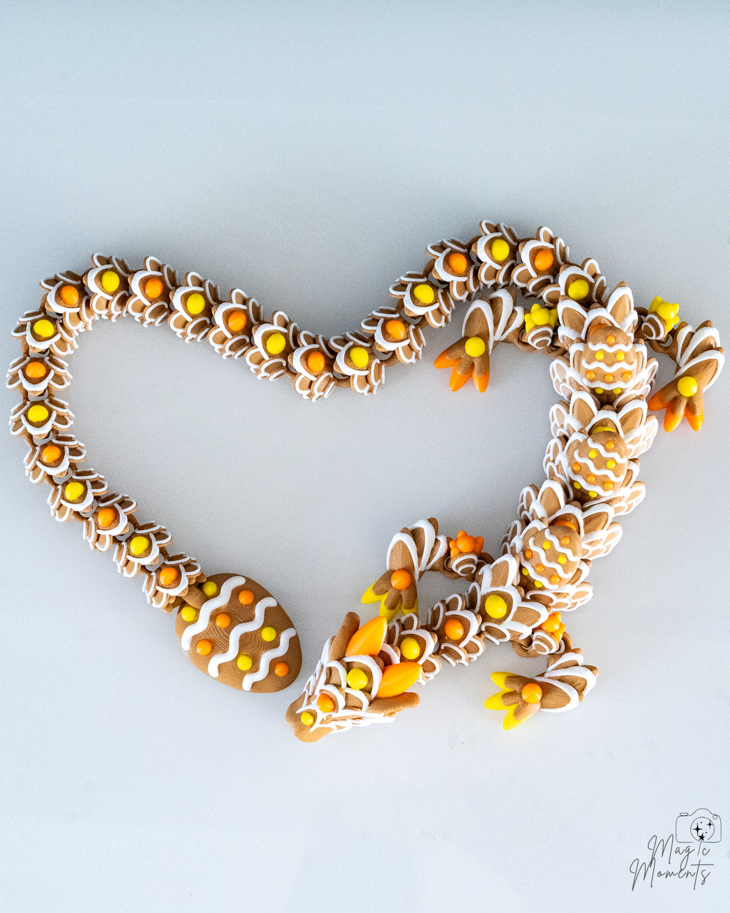 Heart shaped pose with articulated gingerbread dragon