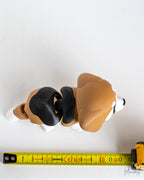 Beagle figure next to measuring tape for scale