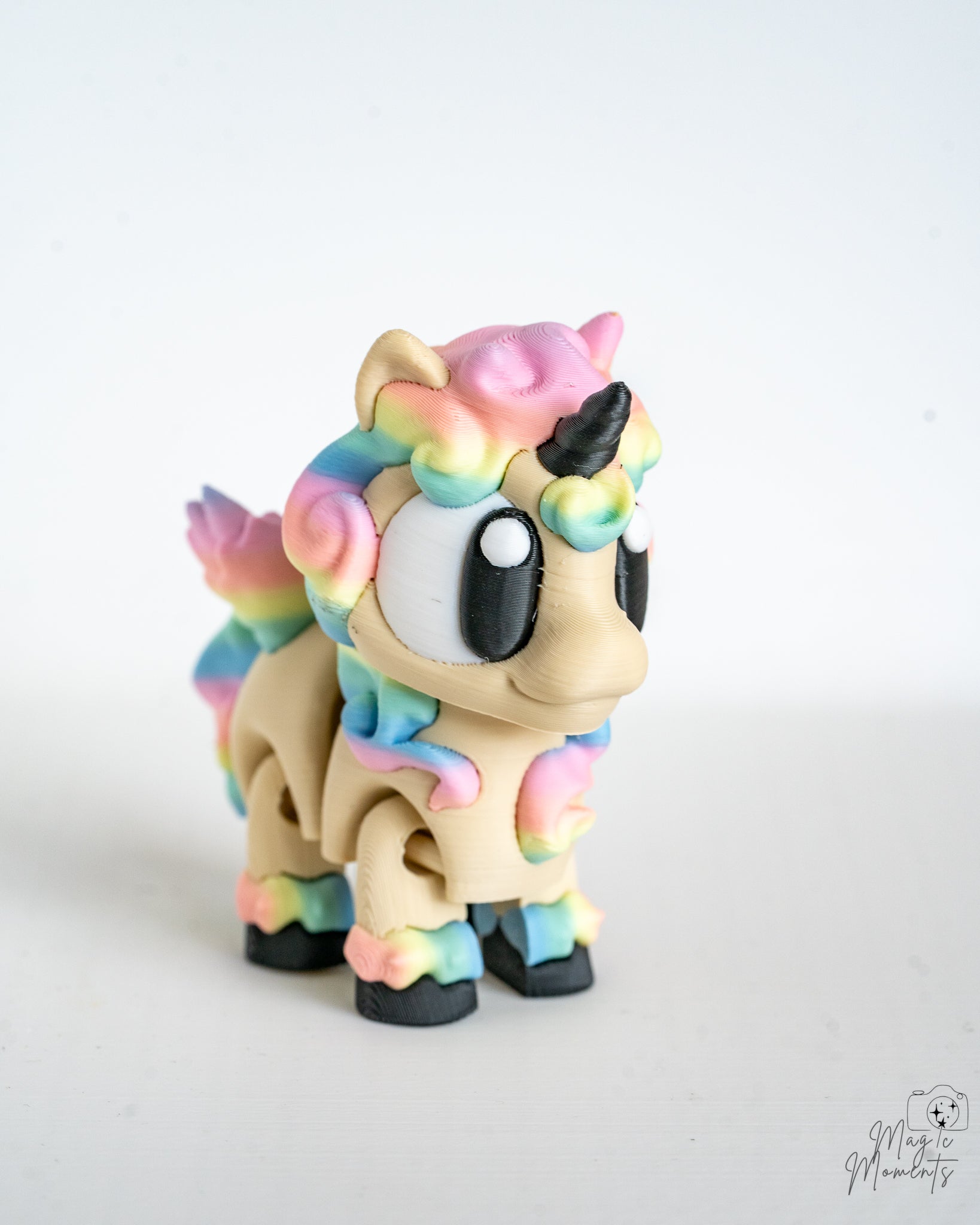 Cute rainbow unicorn figurine viewed from front angle