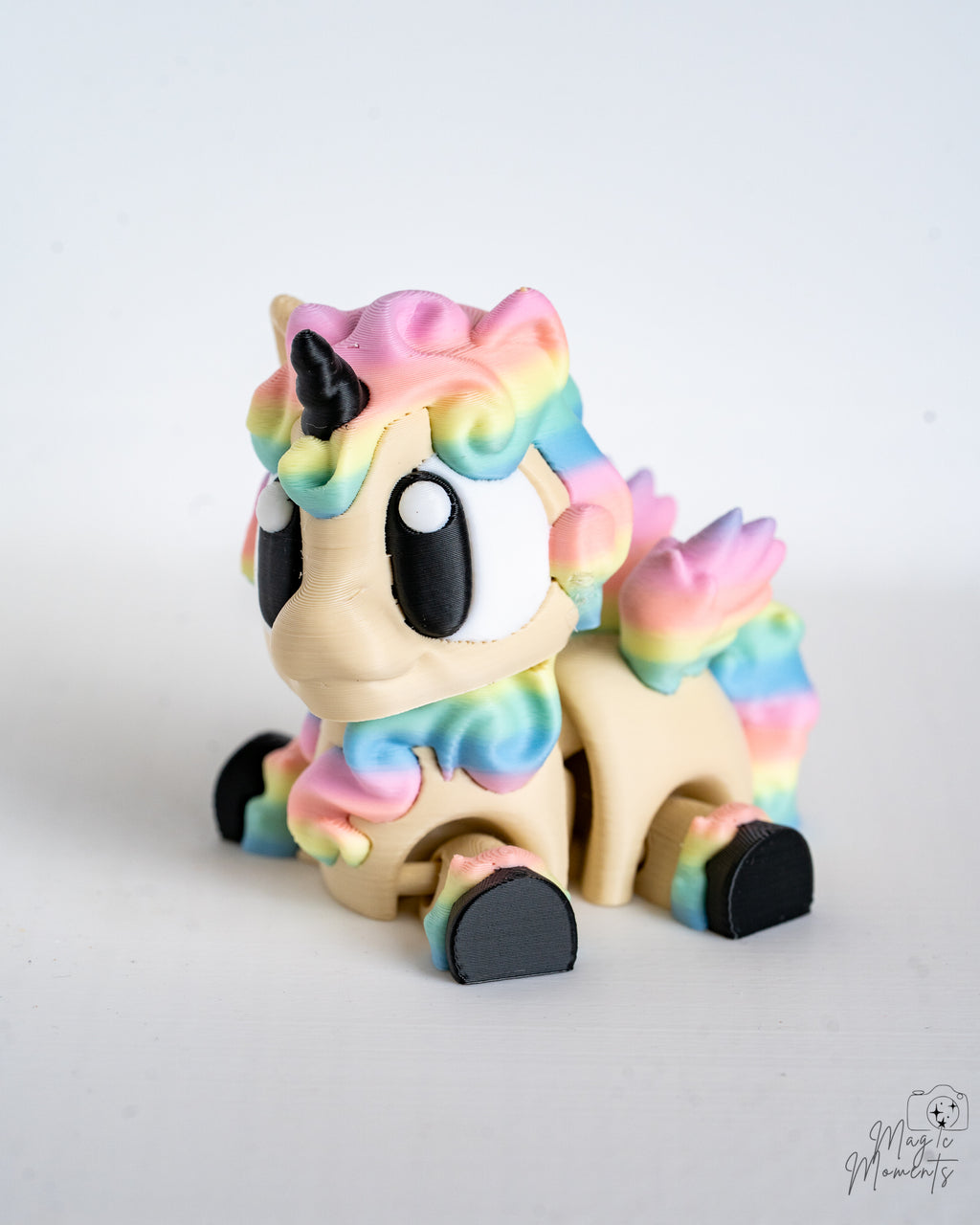 Pastel unicorn figure sitting down