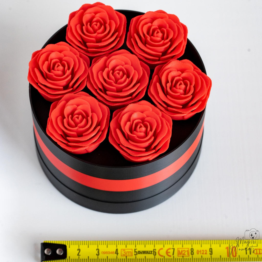 Rose gift box next to measuring tape for scale