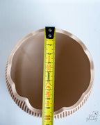 Ribbed egg container with measuring tape for scale
