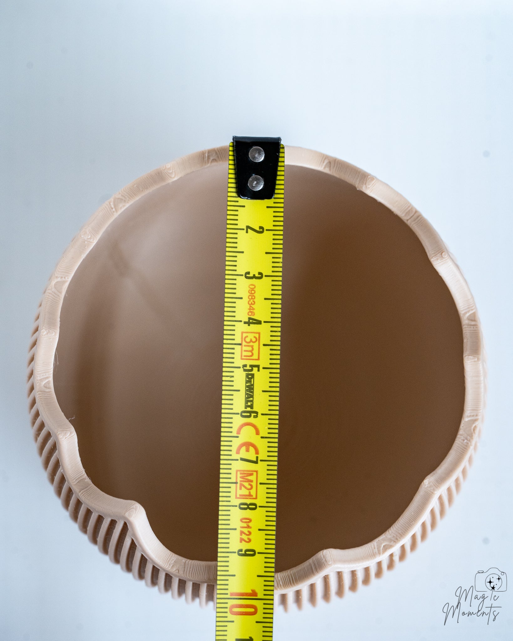 Ribbed egg container with measuring tape for scale