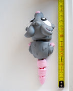 Mouse figure next to measuring tape for scale