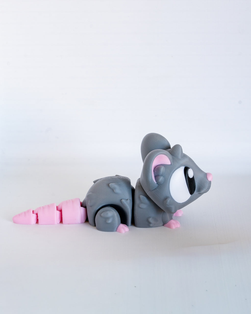 Cute mouse figure viewed from side
