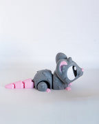 Cute mouse figure viewed from side