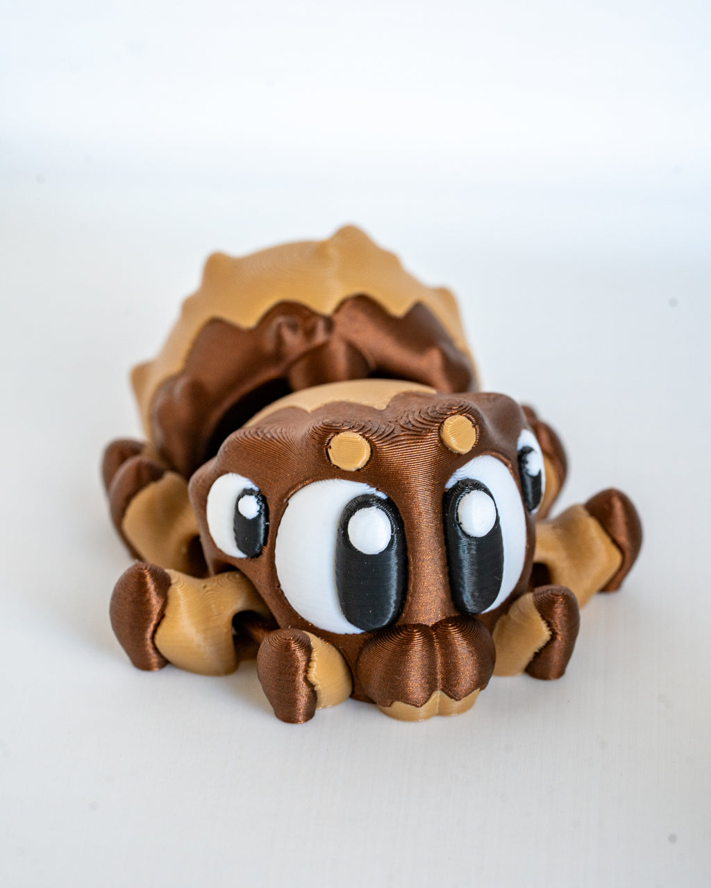 Mini spider figurine with cartoon eyes