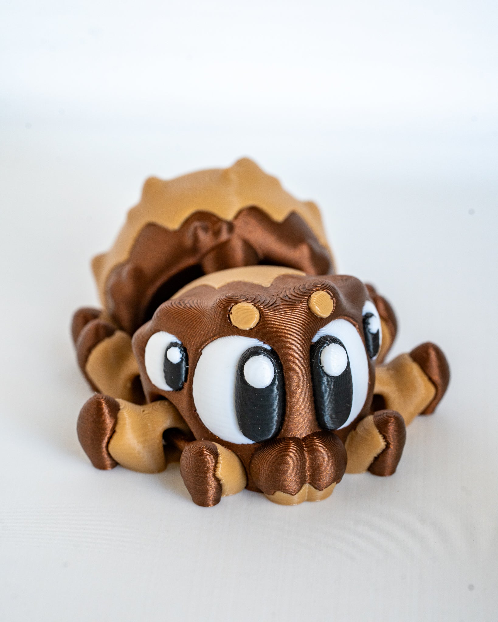 Mini spider figurine with cartoon eyes