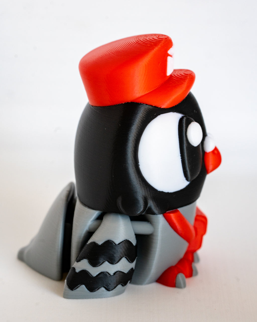 Postman pigeon figure viewed from side