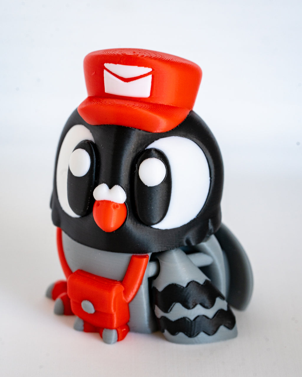 Postman pigeon figure viewed from side