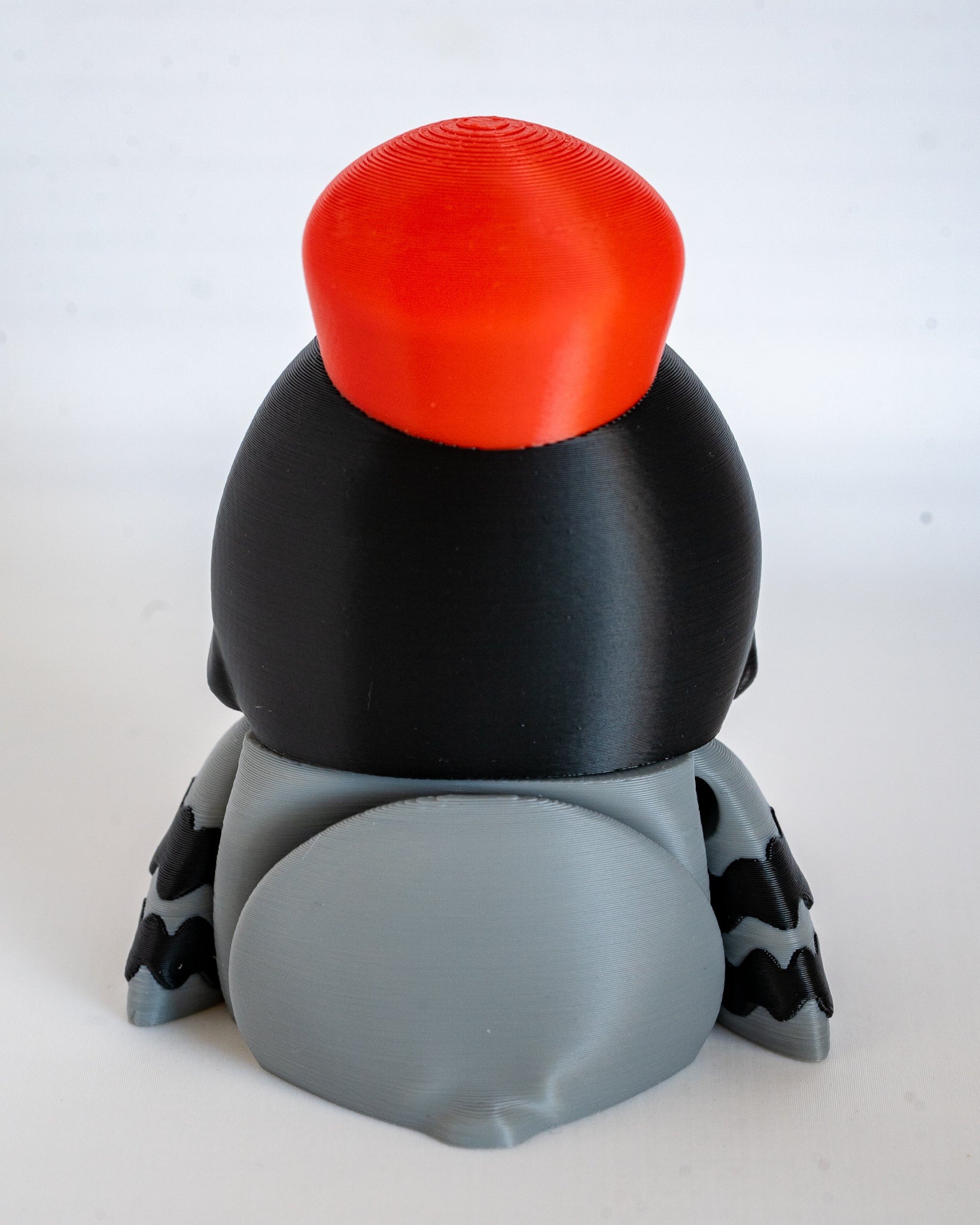 Postman pigeon figure viewed from back