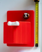 Dog house next to measuring tape for scale
