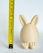 Bunny container next to measuring tape for scale
