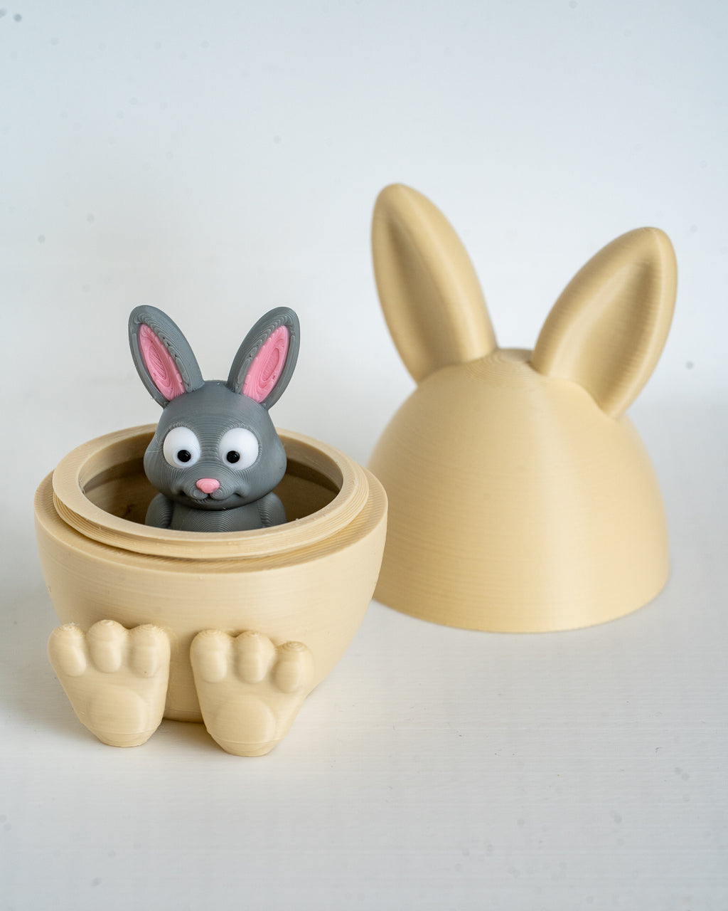 Mini rabbit figure inside bunny egg container