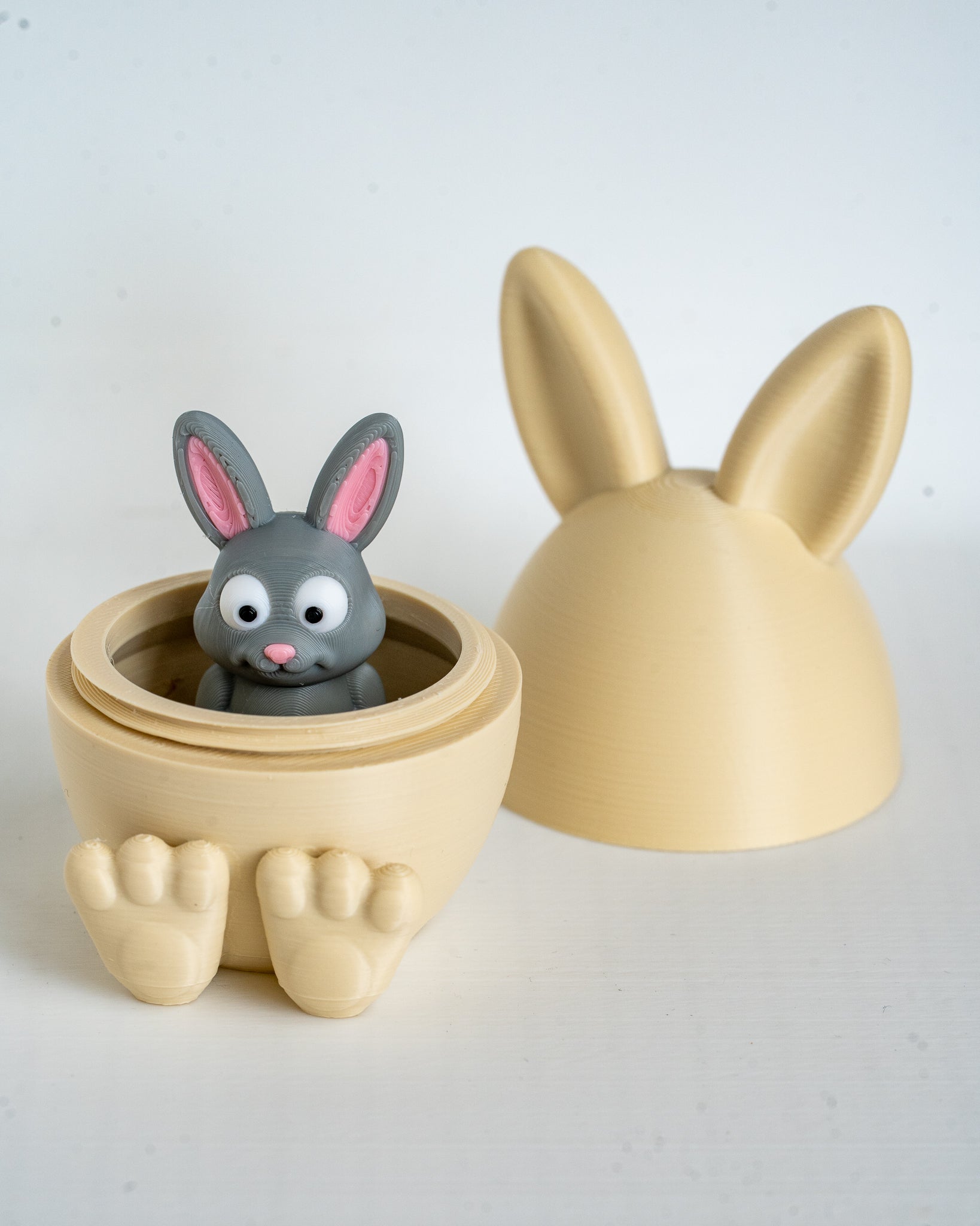 Mini rabbit figure inside bunny egg container