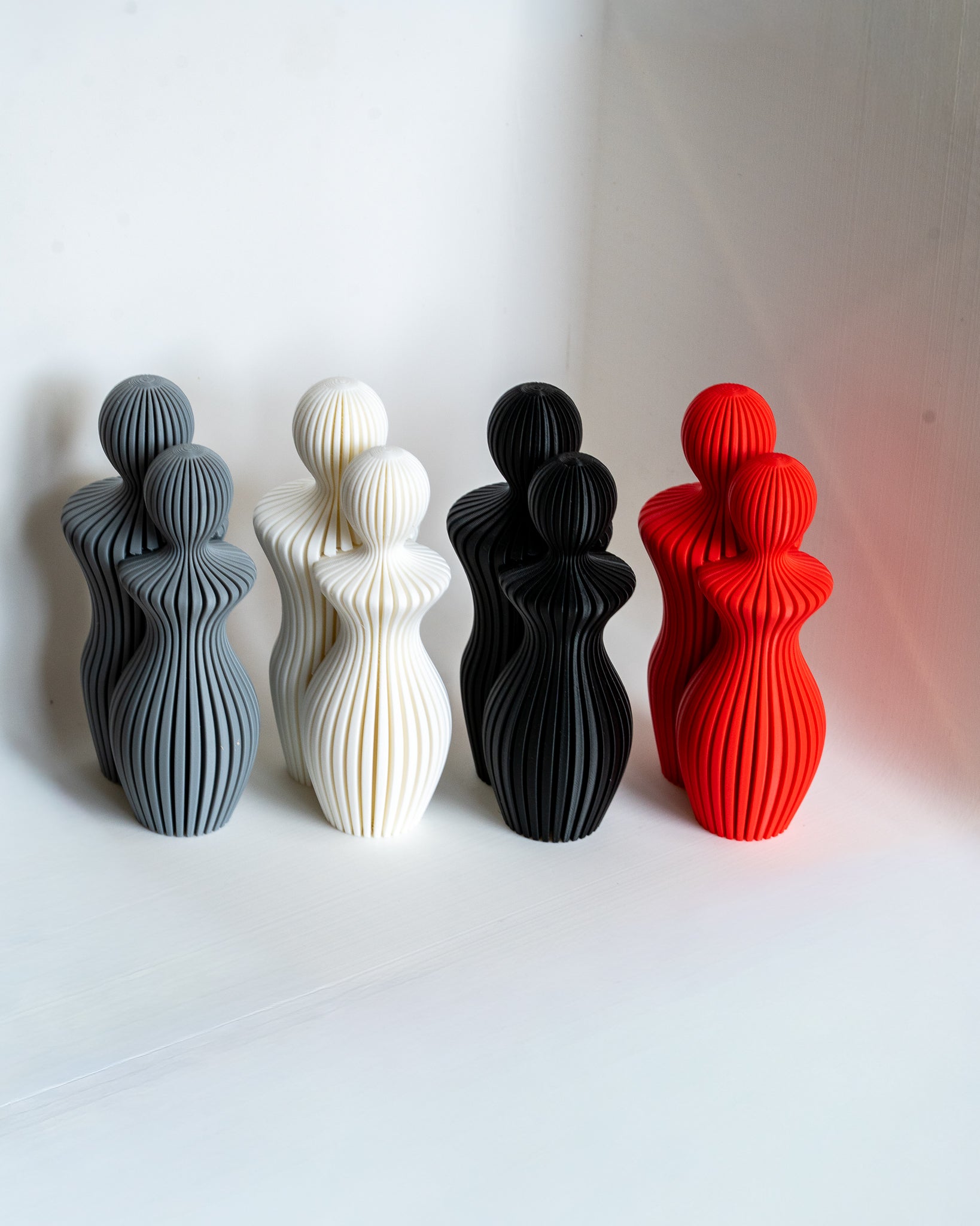 Modern abstract couple sculpture set with ribbed minimalist design