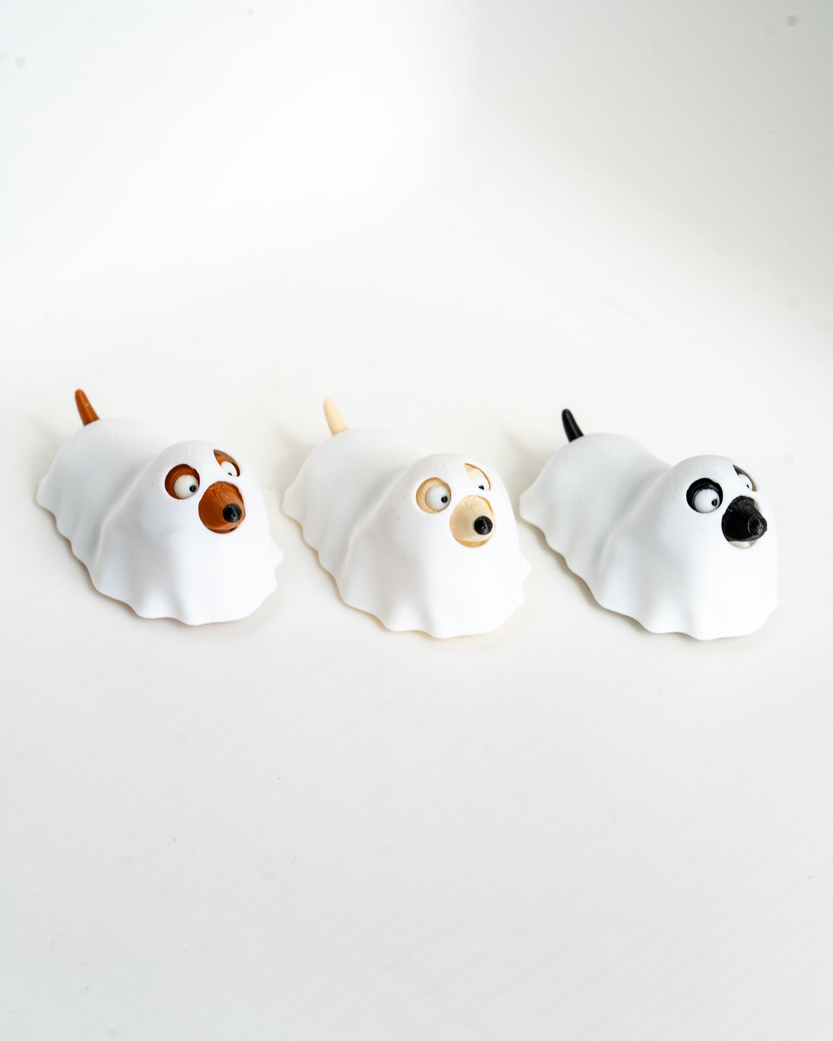 Cute ghost dog figures in different colours