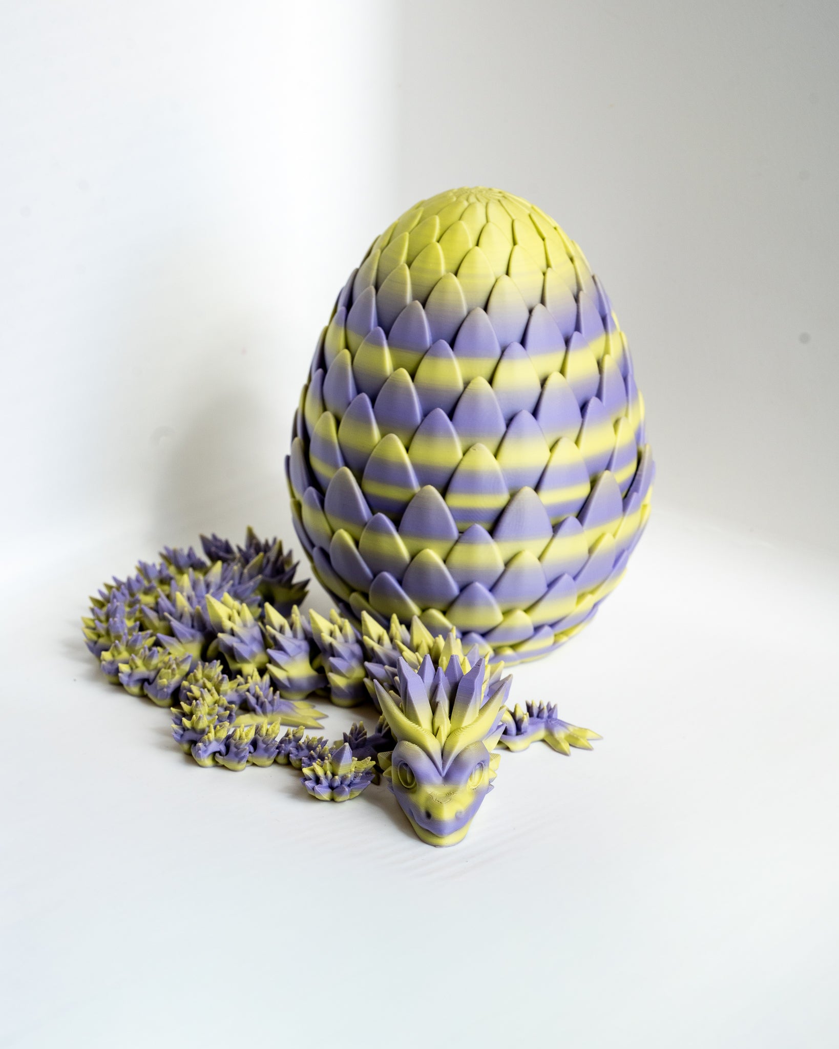 Articulated dragon with matching dragon egg container