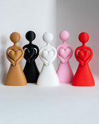 3D printed abstract couple figures in red pink white black and beige colours