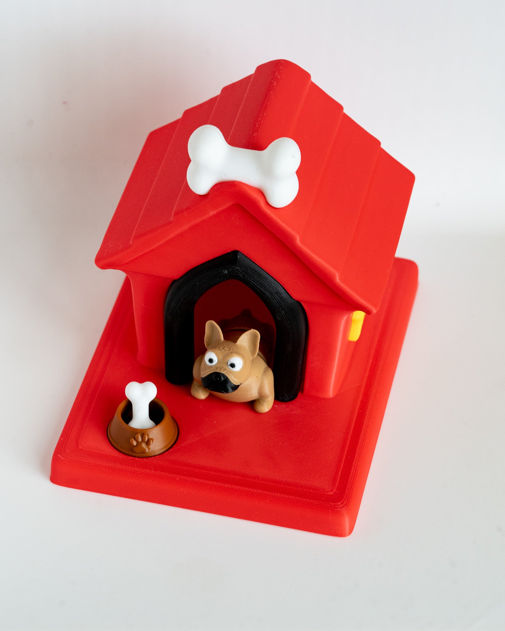 Dog house with french bulldog puppy figure inside