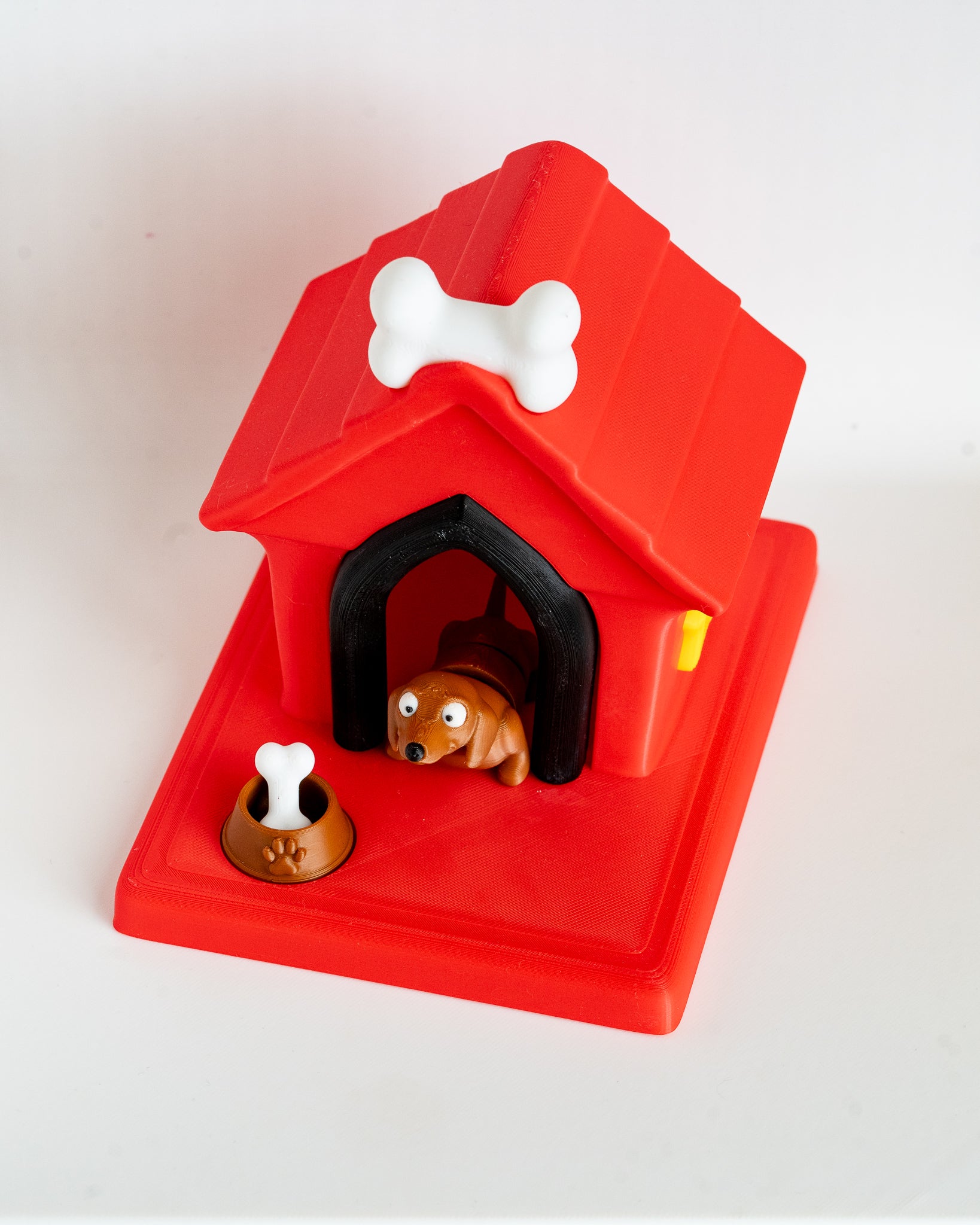 Dog house with daschund puppy figure inside