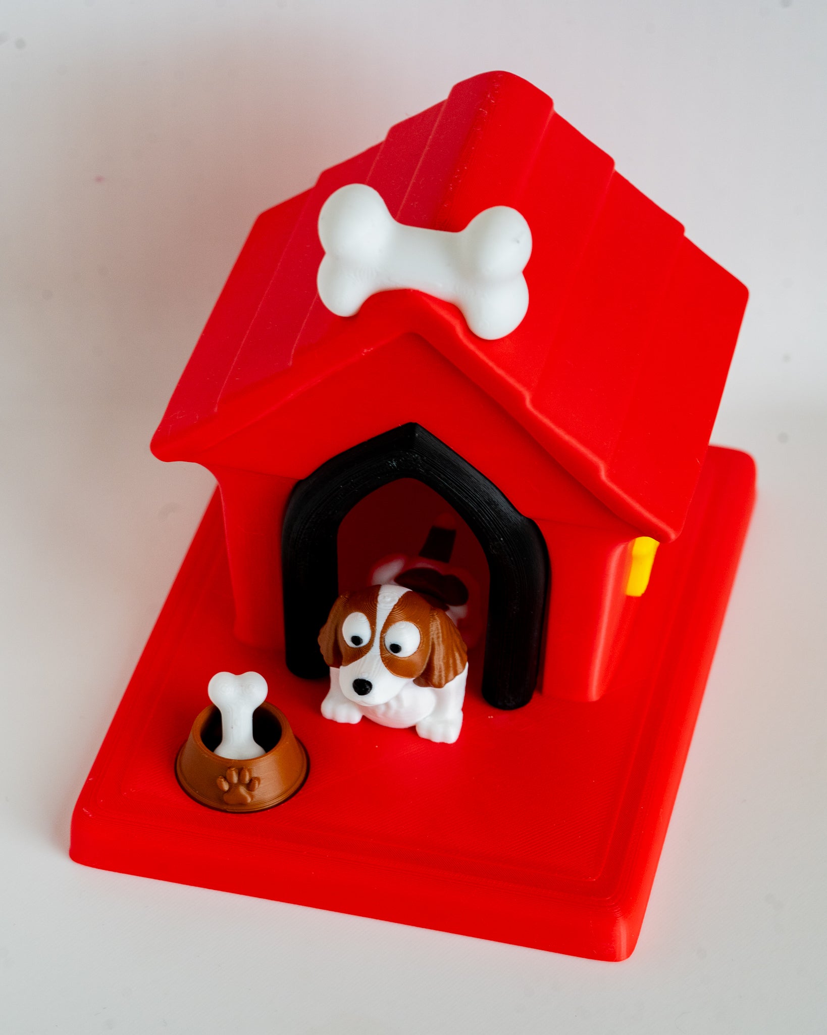 Dog house with springer spaniel puppy figure inside