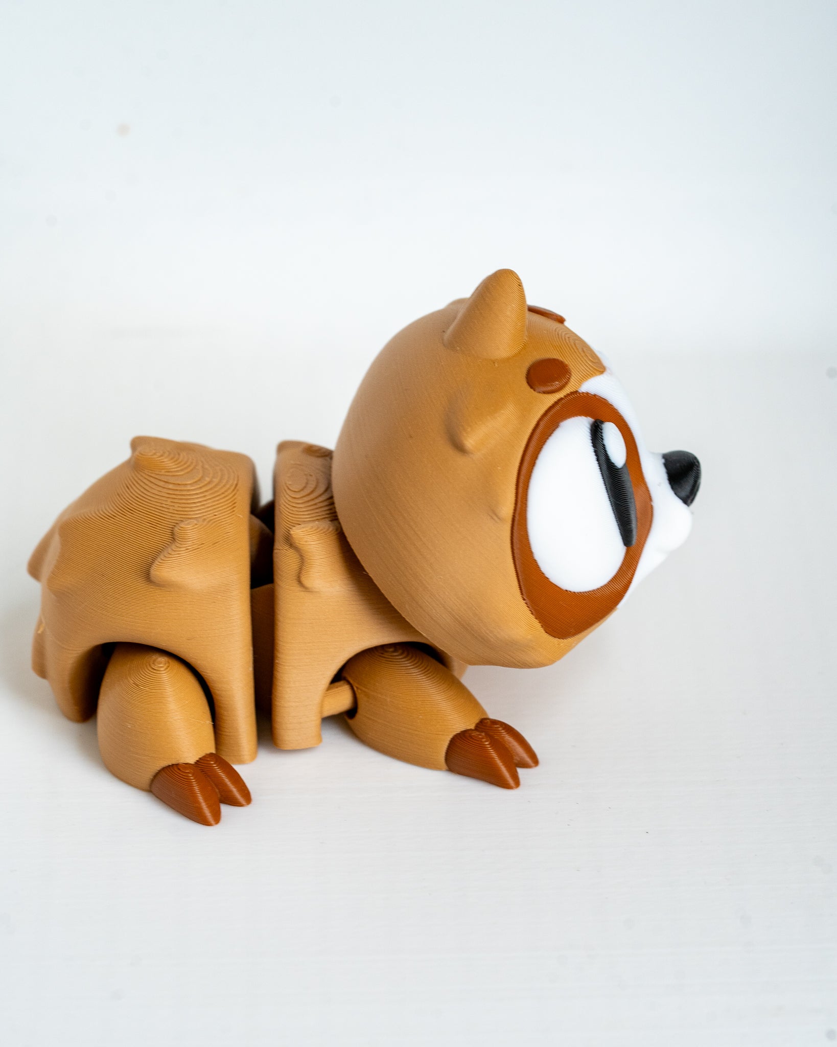 Sloth figure viewed from side