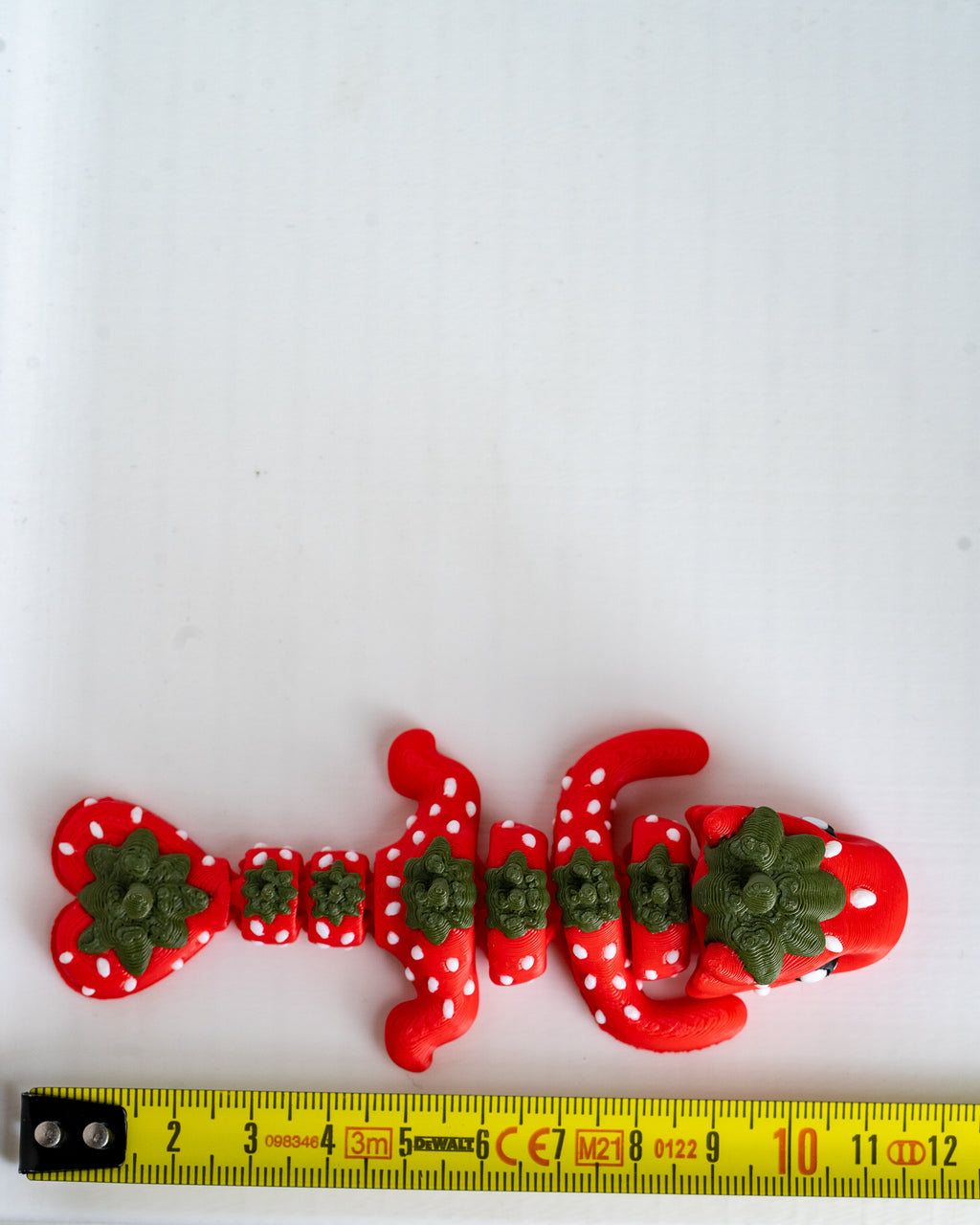strawberry dragon figurine 3d printed articulated dragon with ruler